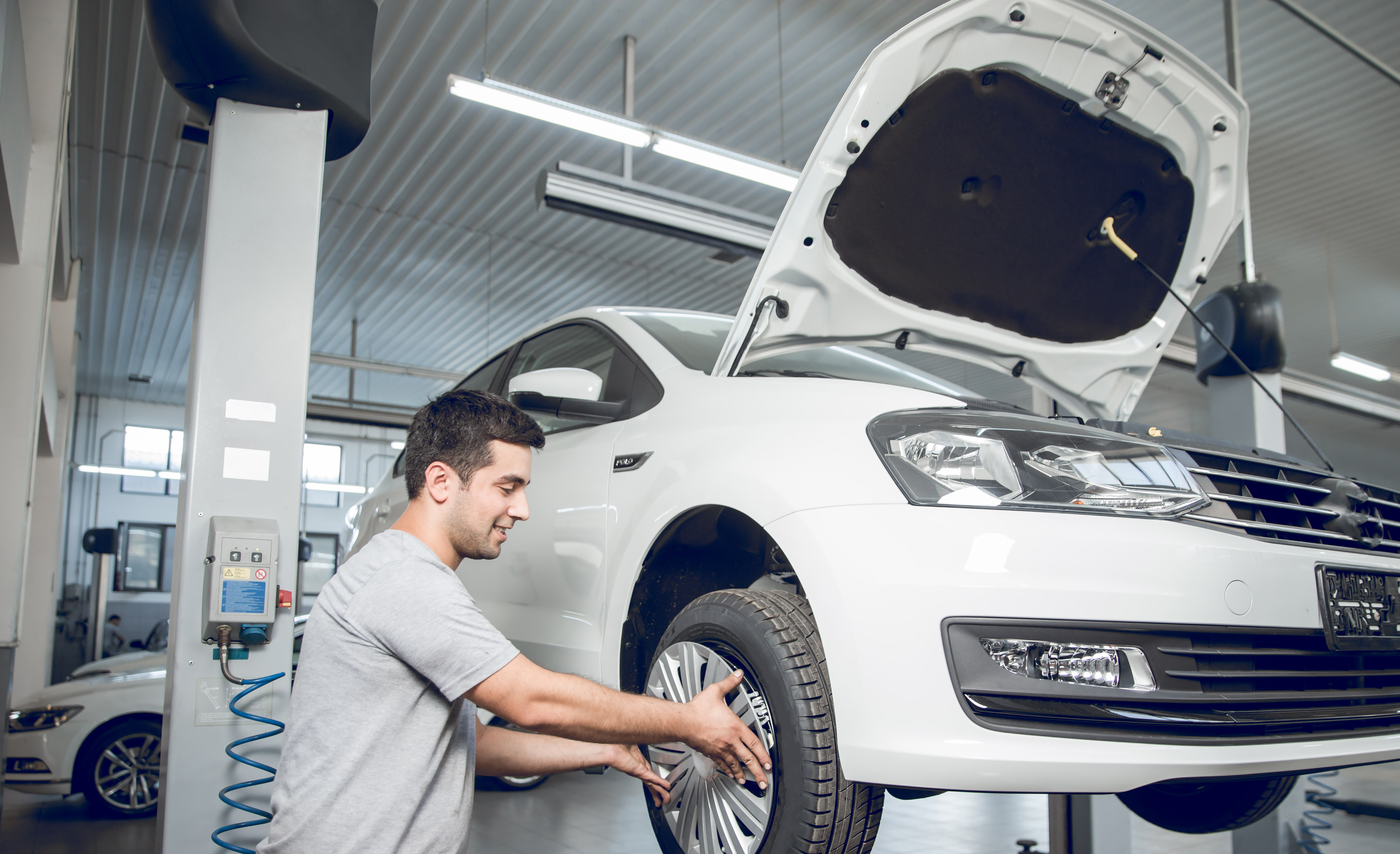 Auto service technician working on a car